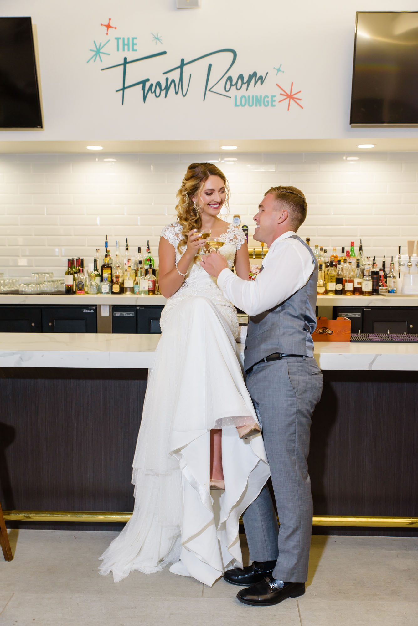 TheAnaheimHotel_207 This is a picture of a couple celebrating their wedding at the Anaheim Hotel across the street from Disneyland. The couple is having a cocktail in the hotel's main bar, The Front Room Lounge.